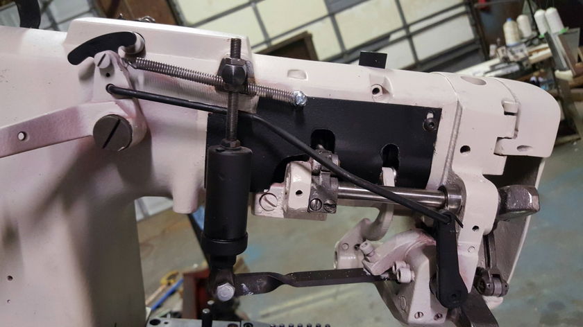 Tape edge machine with a stainless steel table
