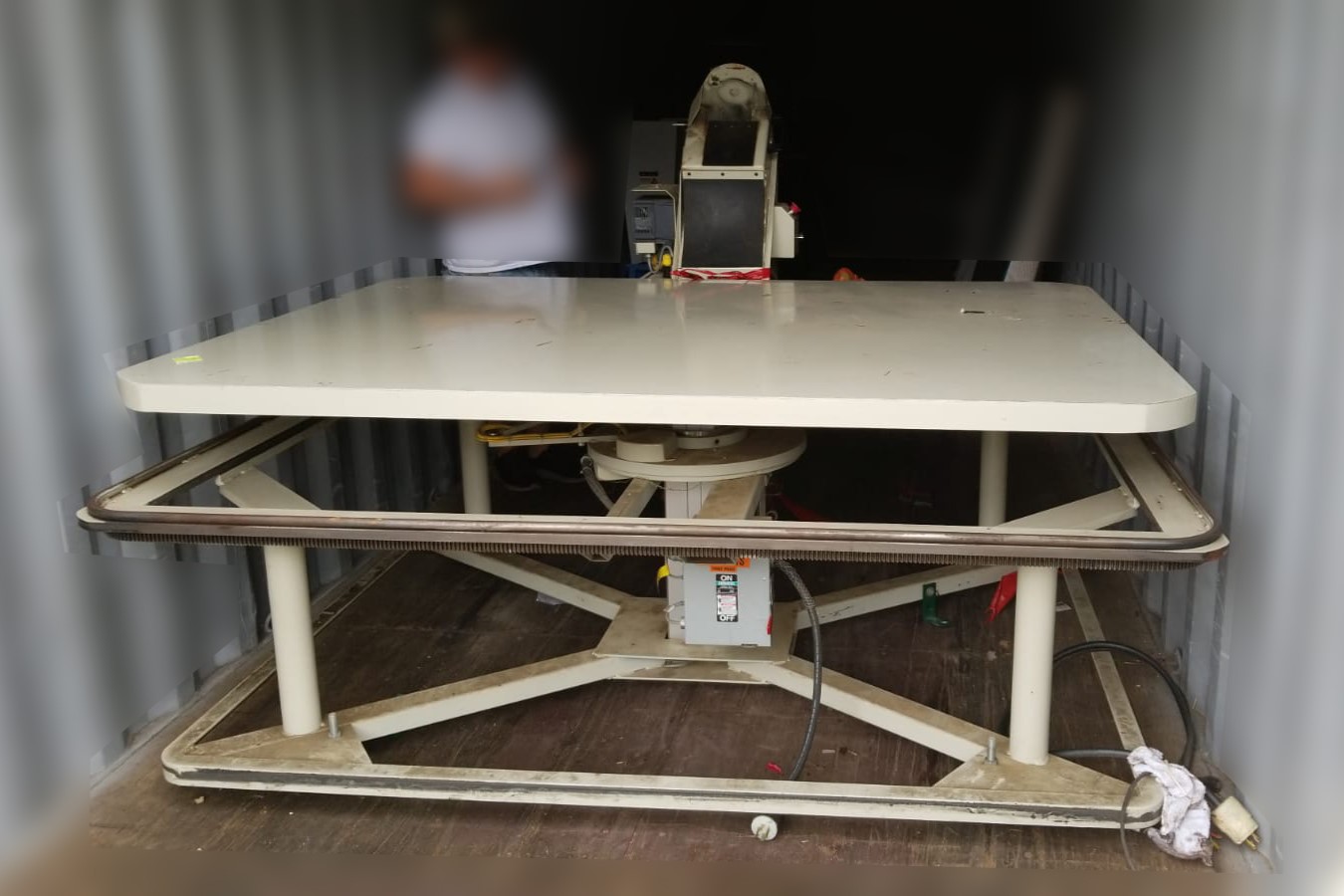 Queen size tape edge table with a mattress on it